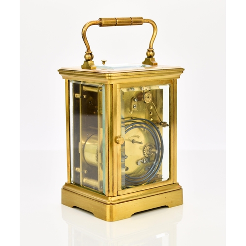 329 - A French brass carriage clock with repeat, early 20th century The case with carrying handle, the 2 1... 