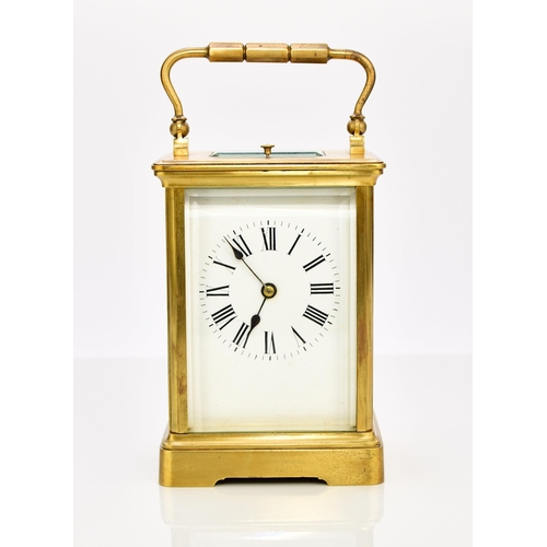 329 - A French brass carriage clock with repeat, early 20th century The case with carrying handle, the 2 1... 