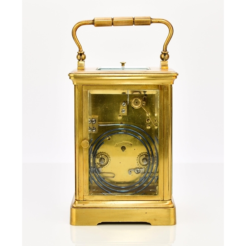 329 - A French brass carriage clock with repeat, early 20th century The case with carrying handle, the 2 1... 