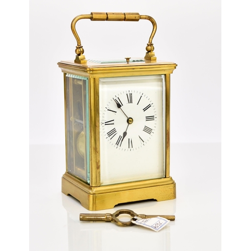 329 - A French brass carriage clock with repeat, early 20th century The case with carrying handle, the 2 1... 