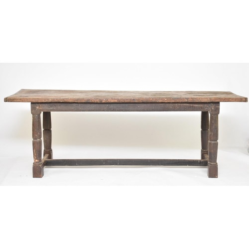 333 - A 17th century and later oak and fruitwood refectory type dining table The rectangular plank top abo... 