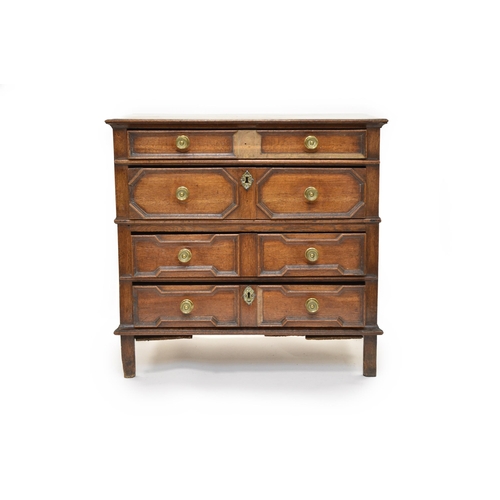 336 - A Jacobean oak chest of four drawers The three plank cleated top above a shallow recessed panel of d... 