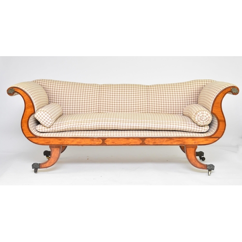 341 - A George IV mahogany and satinwood sofa Of scroll-arm form, raised on outswept supports capped with ... 