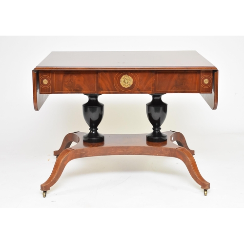 342 - A Regency style parcel ebonised mahogany sofa table, 19th century The boxwood strung top with drop l... 