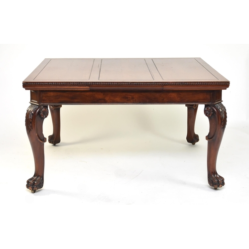 354 - A mahogany draw-leaf dining table, early 20th century The top with guilloche moulded edge above a pl... 