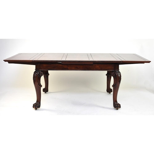 354 - A mahogany draw-leaf dining table, early 20th century The top with guilloche moulded edge above a pl... 