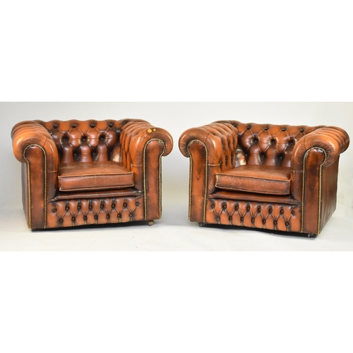 355 - A tan leather Chesterfield suite, 20th century Comprising a three-seat sofa and two armchairs Sofa 1... 