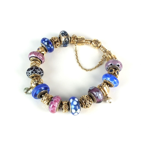 45 - A 14ct gold Pandora herringbone bracelet with twenty charms, the clasp stamped '585 ALE', fifteen of... 