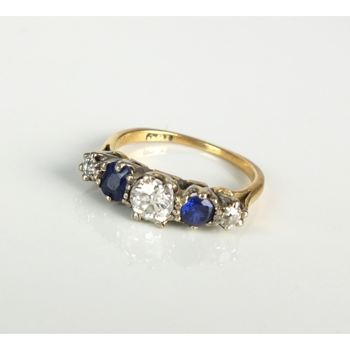 48 - An early 20th century five stone ring, designed as three graduated old cut diamonds interspersed wit... 