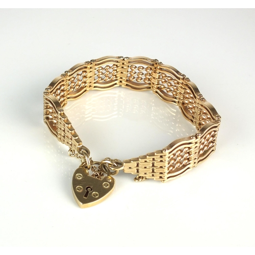 50 - A 9ct gold fancy gate link bracelet, with heart shaped padlock clasp and attached safety chain, weig... 