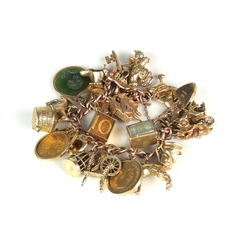 55 - A 9ct gold curb link charm bracelet, with attached 9ct gold and yellow metal charms, to include; two... 