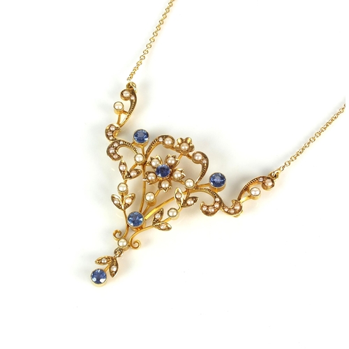 57 - An Edwardian sapphire and seed pearl necklace, designed as a central sapphire and seed pearl flower ... 