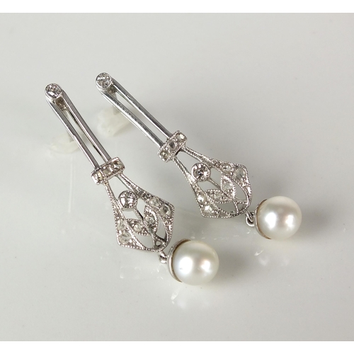 61 - A pair of early 20th century style diamond and cultured pearl ear pendants, each designed as a taper... 