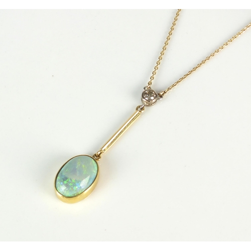 62 - An opal and diamond pendant on chain, designed as an oval cabochon opal collet set in yellow metal t... 