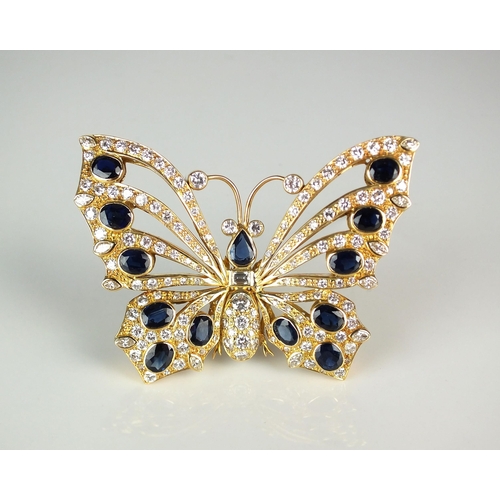 68 - A large diamond and sapphire butterfly brooch, designed as thirteen graduated pear and oval mixed cu... 