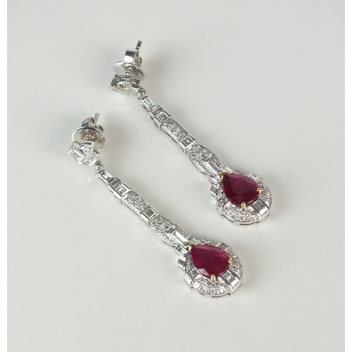 71 - A pair of mid-20th century style ruby and diamond ear pendants, each designed as a single pear cut r... 