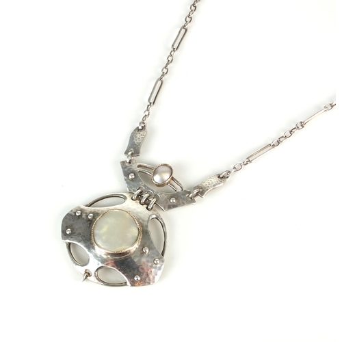 72 - A Murrle Bennett Arts & Crafts silver and mother of pearl pendant on chain, designed as a central ci... 