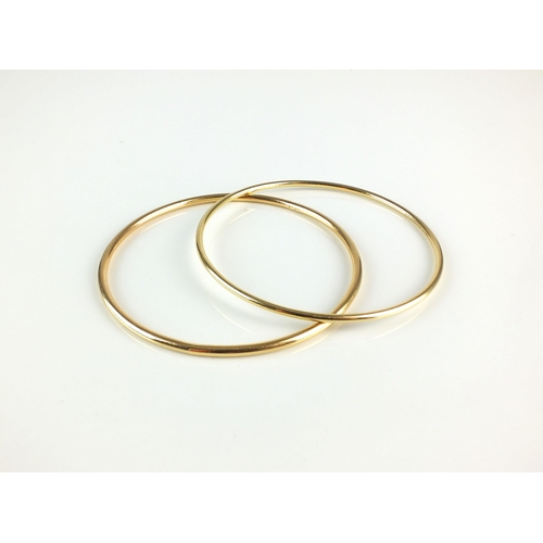 73 - A 18ct gold Tiffany & Co gold bangle, the inner bangle stamped 'Tiffany & Co. 750' with London hallm... 