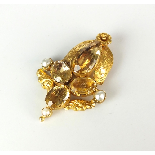 76 - A 19th century citrine and split pearl pendant, designed as four oval-pear faceted citrines and thre... 