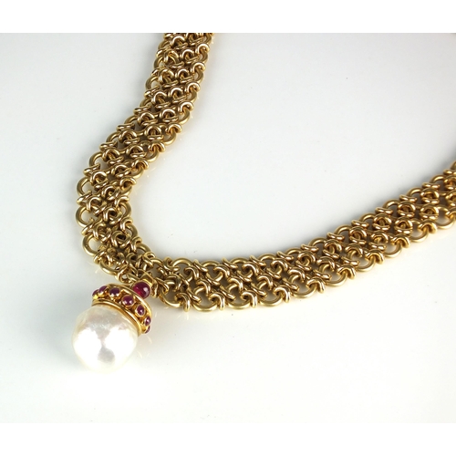 78 - An 18ct gold necklace with baroque cultured pearl and ruby pendant, the yellow gold chain necklace f... 