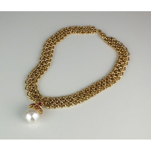 78 - An 18ct gold necklace with baroque cultured pearl and ruby pendant, the yellow gold chain necklace f... 