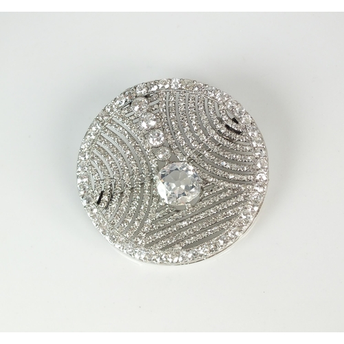 79 - An Art Deco diamond set brooch attributed to Cartier, designed as a central principle old cut diamon... 