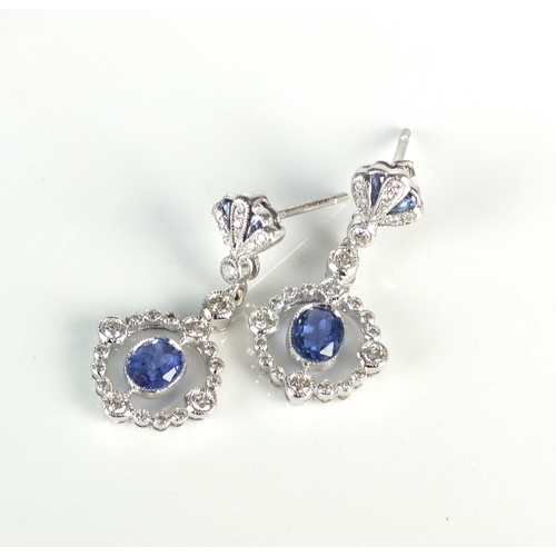 85 - A pair of Edwardian style 18ct white gold sapphire and diamond ear pendants, each designed as a cent... 