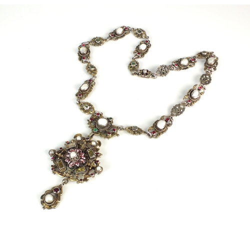 88 - An Austro Hungarian pendant on chain, the white metal pendant set with untested pearls and faceted p... 