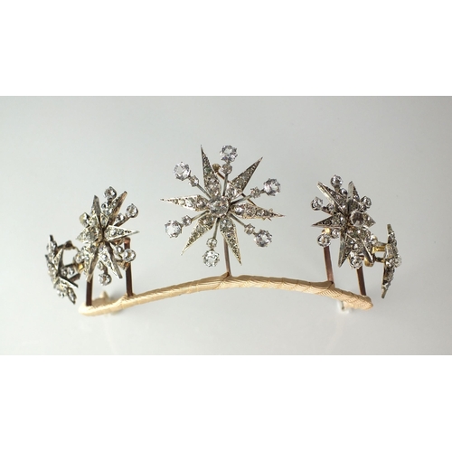 98 - A late 19th century paste tiara, designed as a row of five graduated stylised twelve rayed stars eac... 