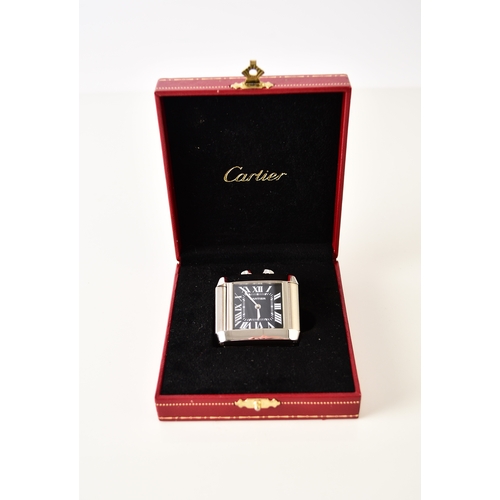 122 - Cartier: A stainless steel folding dual-time alarm clock Model: Tank Francaise Reference: 2945 Date:... 