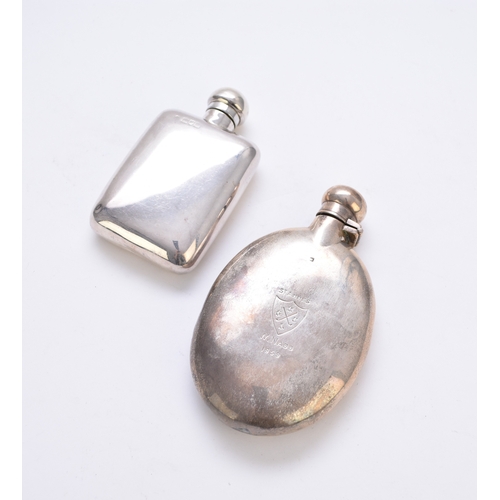 17 - An early 20th century silver hip flask, London, makers and date marks rubbed, 10.5cm high, together ... 