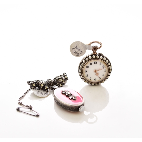 375 - Two lady's enamel and jewelled fob watches The first an open face white metal fob watch, jewelled br... 