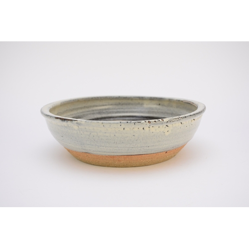 123 - A David Leach (Lowerdown) studio pottery bowl, stoneware with blue glaze, unglazed centre and foot, ... 