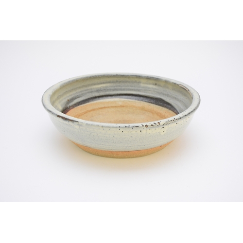 123 - A David Leach (Lowerdown) studio pottery bowl, stoneware with blue glaze, unglazed centre and foot, ... 