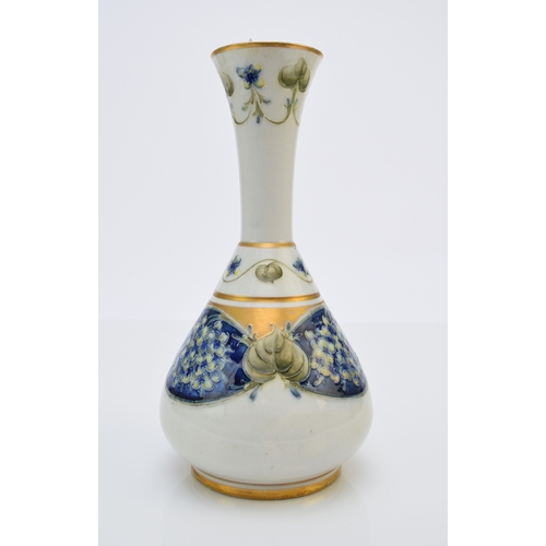 128 - William Moorcroft for Macintyre and Co, circa 1905, a 'Lilac' florian vase, of globe and shaft form ... 