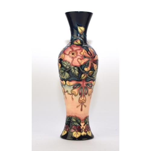129 - A Moorcroft vase in the 'Oberon' pattern designed by Rachel Bishop, dated 1995, 31cm high. Boxed.