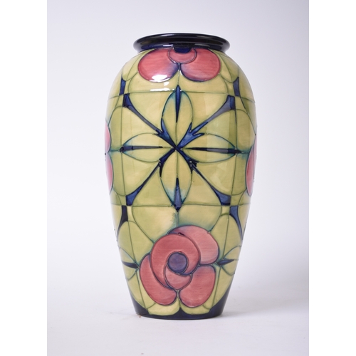 135 - A large Moorcroft 'Rose' vase designed by Sally Tuffin, dated 1992, panels of red flowers with green... 