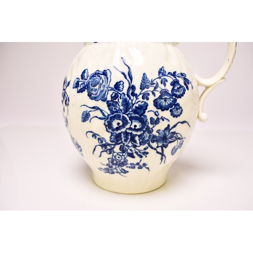 21 - A Caughley 'Bouquets' cabbage leaf maskhead jug, circa 1780-85, transfer-printed in underglaze blue,... 