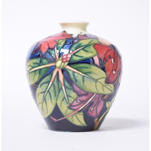 210 - A Moorcroft vase in the Simeon pattern designed by Philip Gibson, dated 2001, 18cm high