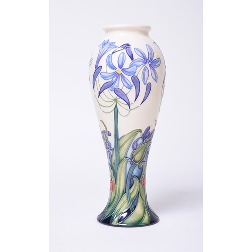 213 - A Moorcroft vase in the 'Fly Away Home' pattern by Emma Bossons, dated 2006, decorated with blue flo... 