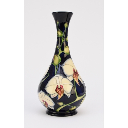 214 - A Moorcroft vase in the 'Chatsworth Orchid' pattern designed by Philip Gibson, a limited edition num... 