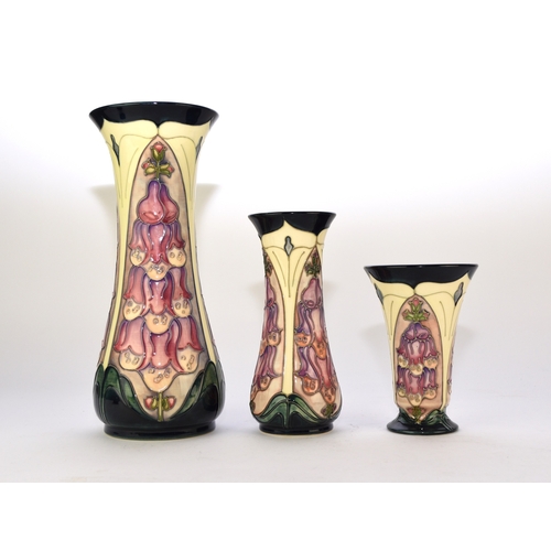 223 - A group of three Moorcroft vases in the 'Foxglove' pattern designed by Rachel Bishop, dated 1995-199... 