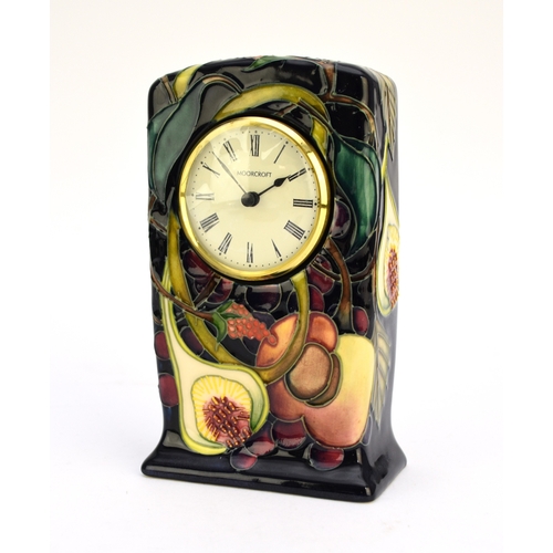 226 - A Moorcroft mantel timepiece in the 'Queens Choice' pattern designed by Emma Bossons, dated 2000, a... 