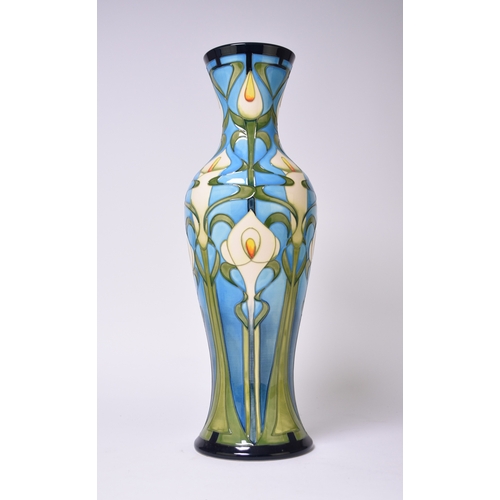 230 - A tall Moorcroft vase in the 'Calla Lily' pattern designed by Emma Bossons and dated 2003, signed by... 