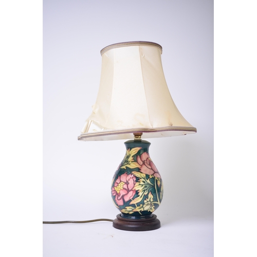 245 - A Moorcroft 'Peony' table lamp designed by Philip Gibson, 22cm high including base but excluding fit... 