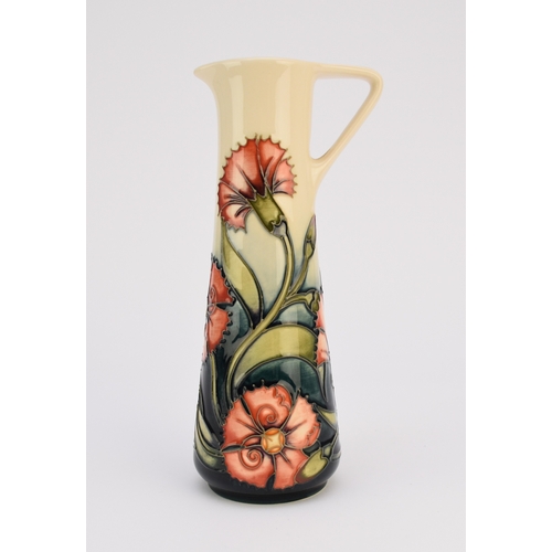 253 - A Moorcroft jug designed by Emma Bossons, dated 1998, pattern name unknown, red flowers on a cream a... 