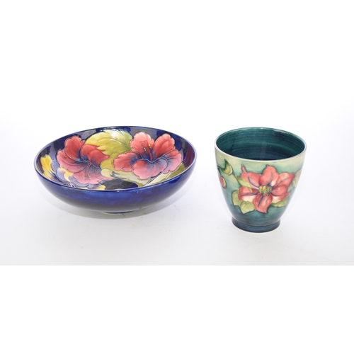 255 - A Walter Moorcroft 'Pansy' fruit bowl, with faded Potter to Late Queen Mary paper label, 26cm diamet... 