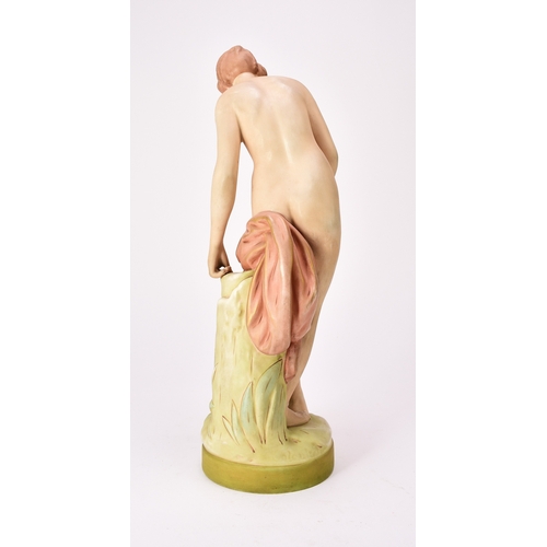 262 - A Royal Dux model of a nude female bather, impressed 27821, raised pink triangle mark, 39.5cm high