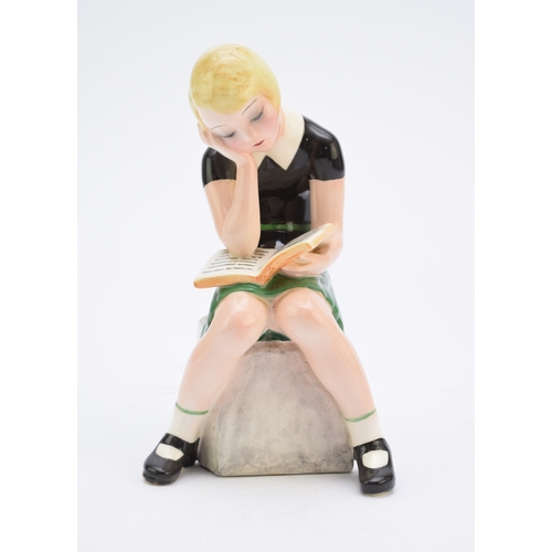 263 - A Goldscheider figure of a girl reading a book modelled by Claire Weiss, no. 6769, painted 'Weiss' t... 