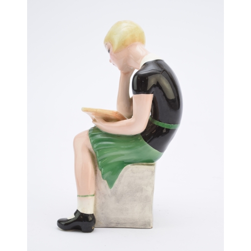 263 - A Goldscheider figure of a girl reading a book modelled by Claire Weiss, no. 6769, painted 'Weiss' t... 